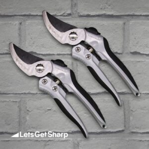 Secateurs on a brick background after being sharpened
